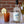  Bloody Mary with lemon wedge and bottle of Dos Vinas vodka on a table.