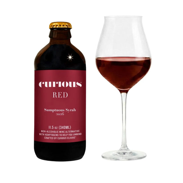 Bottle of 'Curious Red' Sumptuous Syrah 2026 with a glass of wine on a white background